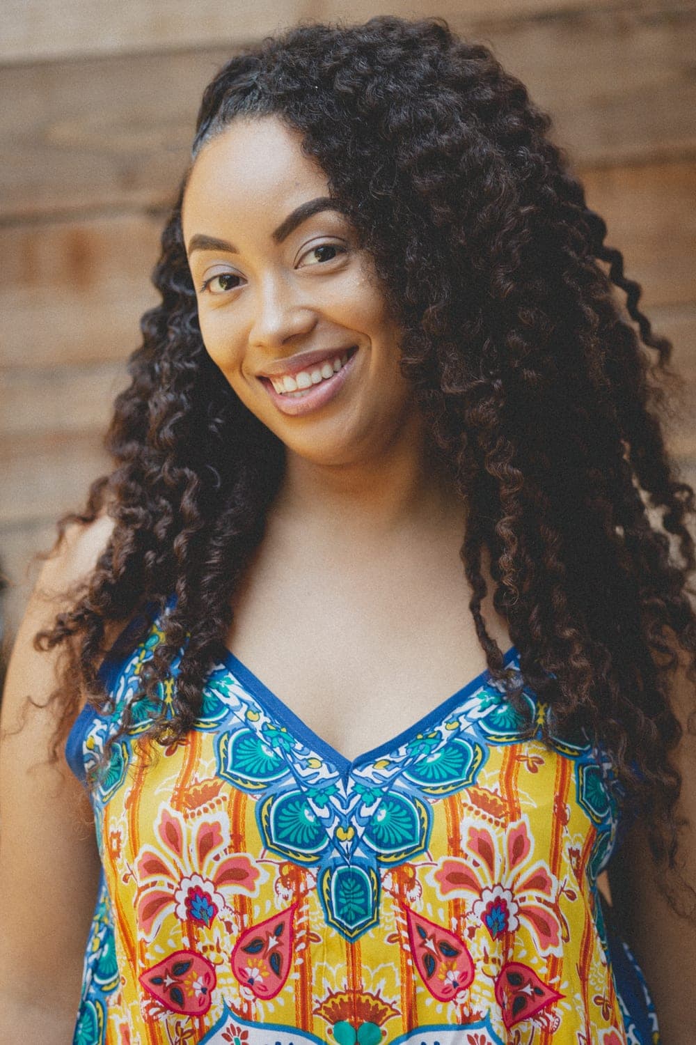 A member of the Roots Naturelle community smiling