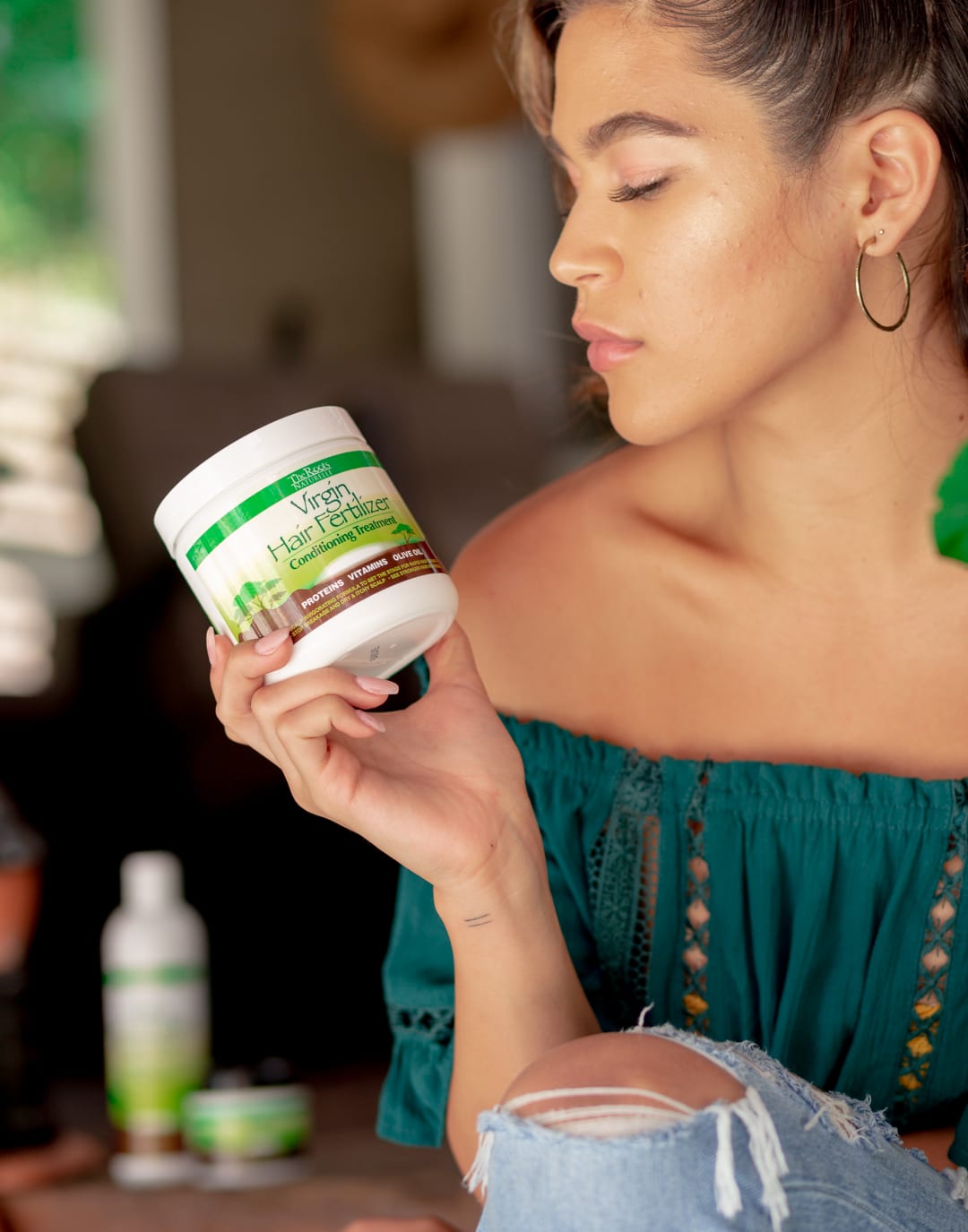 A model with The Roots Naturelle Virgin Hair Fertilizer